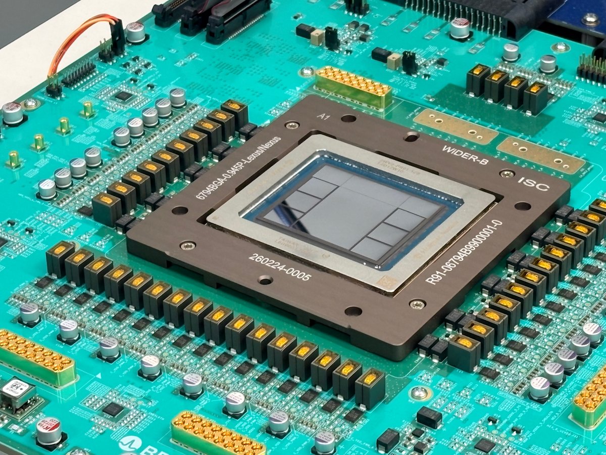 Close-up photograph of the OpenAI Jalapeño inference chip mounted on a teal circuit board, showing the chip package and surrounding board components.